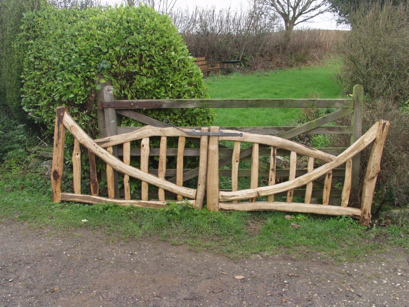 Curved wood entrance gate Ed Brooks Ed Brooks